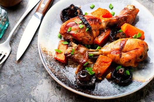 Grilled chicken thigh with vegetables for Thanksgiving Day. Autumnal recipe.