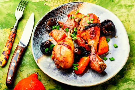 Grilled chicken thigh with vegetables for Thanksgiving Day. Autumnal recipe.