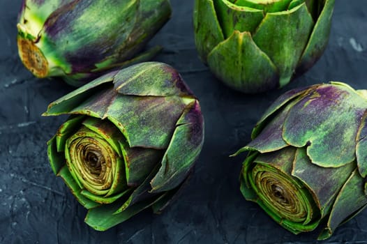 Uncooked unopened artichoke buds, food. Italian cuisine
