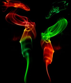 abstract colored smoke in a black background