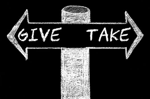 Opposite arrows with Give versus Take. Hand drawing with chalk on blackboard. Choice conceptual image