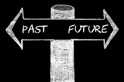Opposite arrows with Past versus Future. Hand drawing with chalk on blackboard. Choice conceptual image