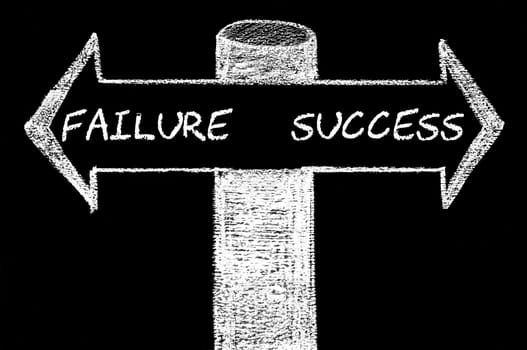 Opposite arrows with Failure versus Success. Hand drawing with chalk on blackboard. Choice conceptual image