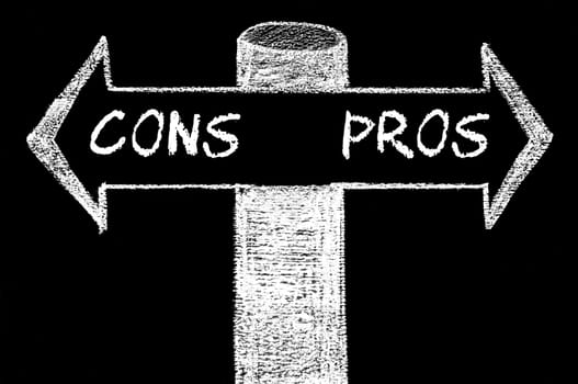 Opposite arrows with Pros versus Cons. Hand drawing with chalk on blackboard. Choice conceptual image