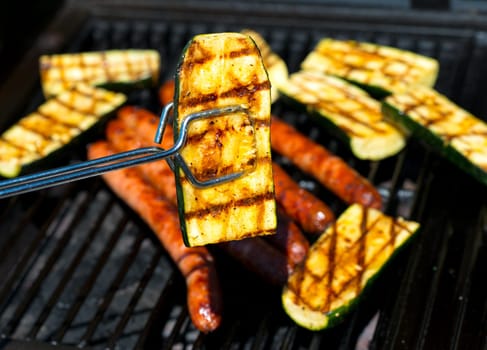 barbecue with five sausage and grilled zucchini