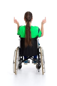 young man in a wheelchair in front of white background is angry