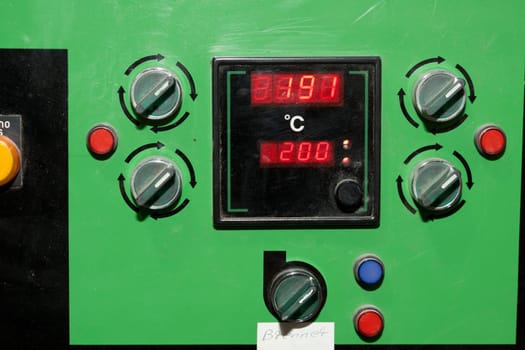 Adjustment levers and indicators on an industrial machine
