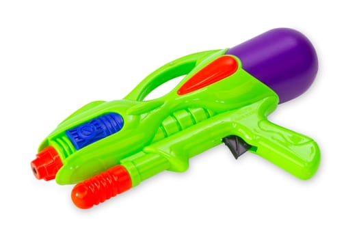 Water pistol released on white background