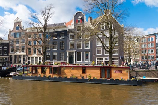large houseboat in the amsterdam canals.
