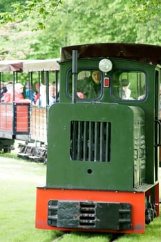 Berlin,Germany – May 06,2015: The park railway of the Britzer Garten in Berlin's Neukölln district with visitors and tourists on May 6,2015 in Berlin.