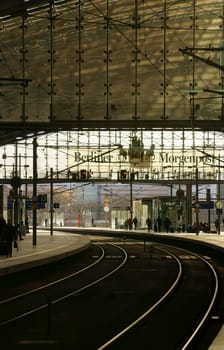Berlin,Germany – April 02,2015: A winding rail line leads out of Berlin's main train station with an advertisement by the Berliner Morgenpost on April 2,2015 in Berlin.