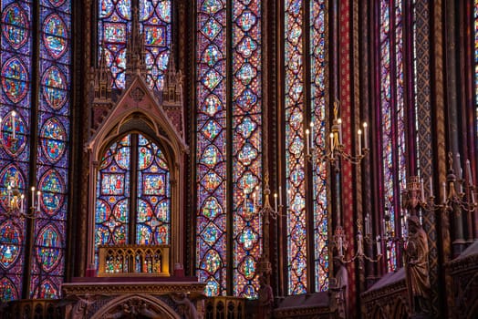 The inside of the famous Sainte Chapelle in Paris with impressing colorful windows, France