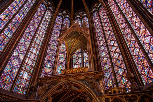 The inside of the famous Sainte Chapelle in Paris with impressing colorful windows, France