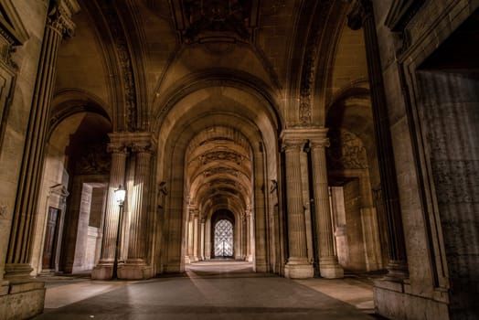 The famous Louvre Palace of Paris at night, France