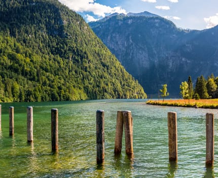 Bollards at the Pier Saint Bartholomew at the upper Lake Koenigssee in Bavaria, Germany