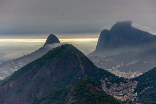 Rio city sсattered among the hills in sunset time, Rio de Janeiro, Brazil