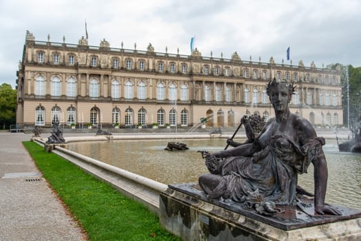 HERRECHNHIEMSE, GERMANY - SEPTEMBER 23, 2022 - Sculpture of a Laying Woman in the Palace Garden of Herrenchiemsee in Bavaria, Germany