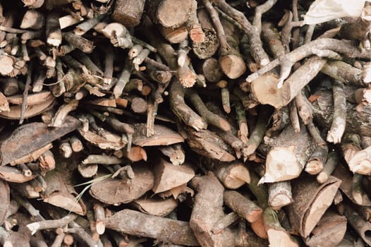 Stack of chopped firewood abstract background.
