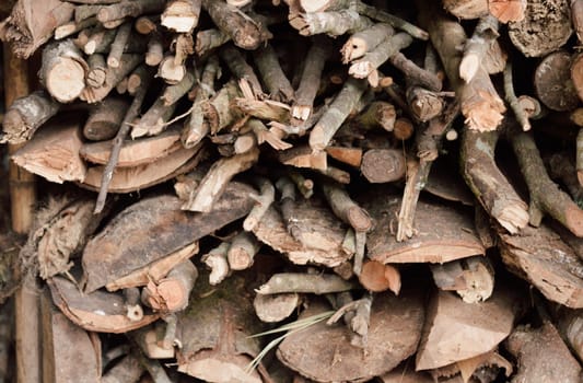 Stack of chopped firewood abstract background.