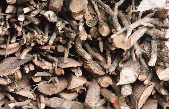 Stack of chopped firewood abstract background.
