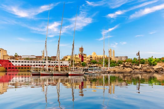 Sailboats in The Nile near the Coptic Orthodox Cathedral of the Archangel Michael, Aswan, Egypt.