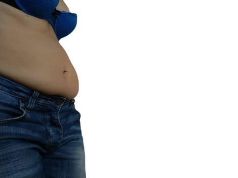 Saggy belly. Folds of leather and fat on the sides hanging over the waist of the jeans. A figure spoiled by overeating or pregnancy. Obesity and Diabetes. White background. Cellulite flabby muscles.