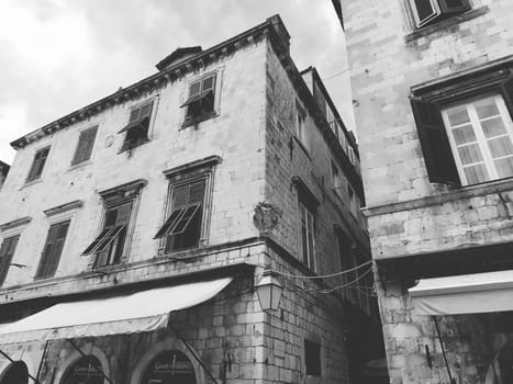 Stradun, Stradone is the main street of the historic city center of Dubrovnik in Croatia. architectural sights. A popular place for tourist walks. August 14, 2022 Black and white.