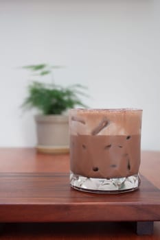 Iced coffee with micro foam in coffee shop, stock photo