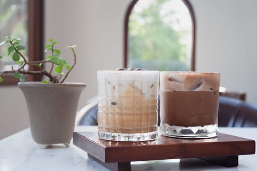 Iced coffee with micro foam in coffee shop, stock photo