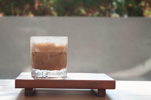 Iced coffee with micro foam in coffee shop, stock photo