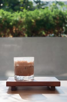 Iced coffee with micro foam in coffee shop, stock photo