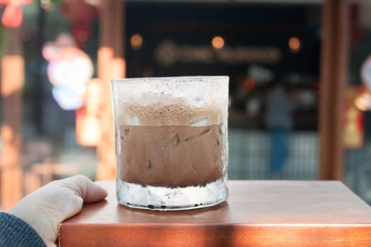 Iced coffee with micro foam in coffee shop, stock photo
