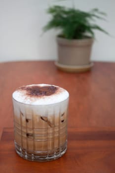 Iced coffee with micro foam in coffee shop, stock photo