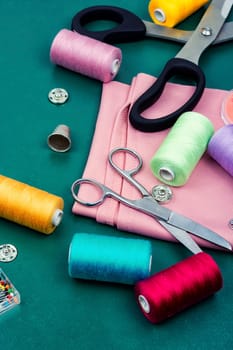 Home sewing kit, scissors, set needles, buttons and threads. Sewing items