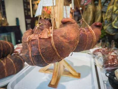 Extremaduran buche displayed at butchers shop. Pork stomach stuffed with ribs, tail, tongue and snout