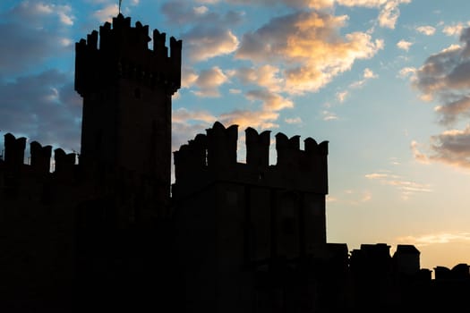Sirmione, Italy - June 2022: Sirmione castle on Garda lake. Scenic mediaeval building on the water