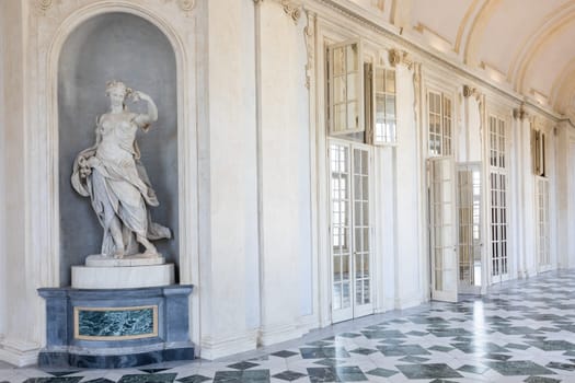 Venaria Reale, Italy - January 2023: luxury interior old royal palace. Gallery perspective with window