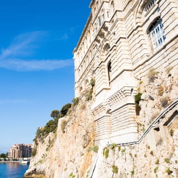 Principality of Monaco - Oceanographic Museum exterior with panorama, blue sea and sky