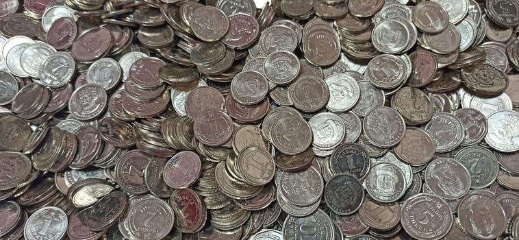 Pile of Ukrainian metal coins. Ukraine money. Obverse of contemporary coin denomination Ukrainian hryvnia. Ukrainian iron money. Ukrainian coins. Money in metal. Pile of Ukrainian coins