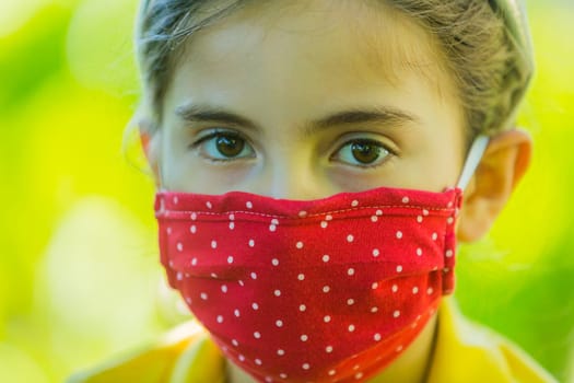 Little girl with mask against corona virus covid outdoor