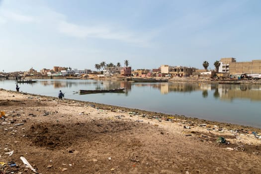 Saint Louis, Senegal: 28 January 2019 - Fishing boats resting on the riverbank of the river Senegal