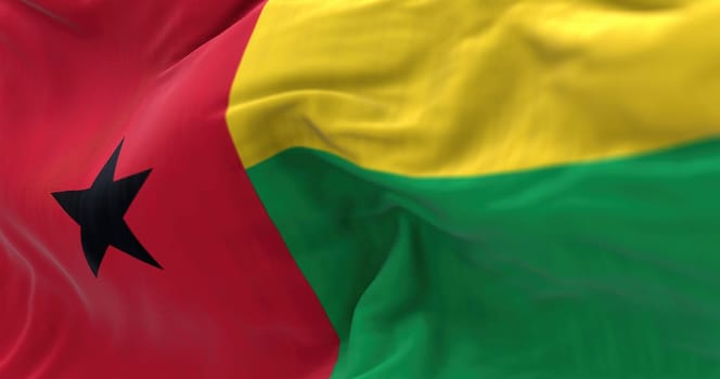 Detail of Guinea-Bissau National flag waving. The Republic of Guinea Bissau is a West African State. Rippled fabric. Textured background. Realistic 3d illustration. Close-up