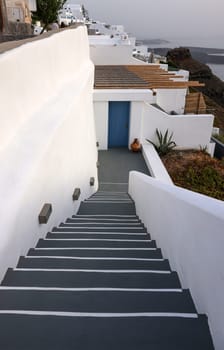 Narrow stone steps, a traditional piece of architecture on the island of Santorini. Greece
