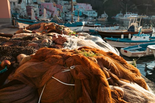 Pretty fishing village, colourful fishermen's houses, and fishing nets, Marina Corricella Procida Island, Bay of Naples, Italy.