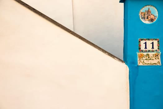 Procida island with colorful houses in small town street