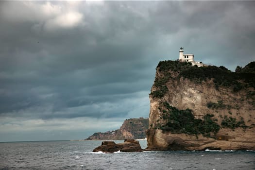 Capo Miseno and its lighthouse that marks the northwestern limit of the Gulf of Naples, Italy