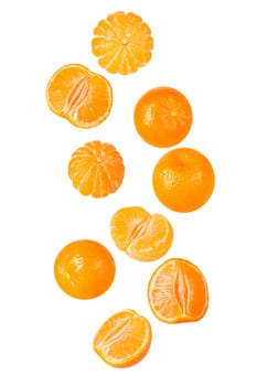 Isolated flying grapes. Nine whole and sliced mandarin fruits falling on white with clipping path as package design element and advertising. Full depth of field.