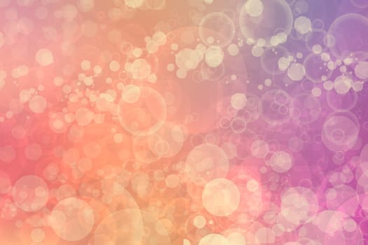 A festive abstract orange pink yellow gradient background texture with glitter defocused sparkle bokeh circles. Card concept for Happy New Year, party invitation, valentine or other holidays.