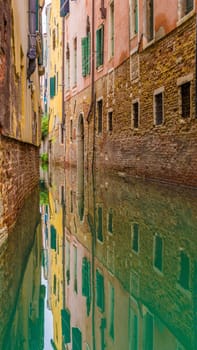 Vertical shot of colorful canal houses in venice 9:16 smartphone format.