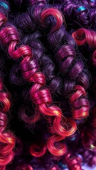 Curly hair texture. Bright pink, purple curly curls. High quality photo